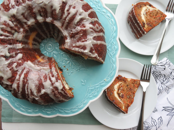 Cheesecake Swirled Carrot Bundt Cake with Walnuts and Raisins